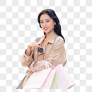 手提购物袋逛街的青年女性图片