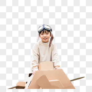 小男孩抱着纸盒箱飞机嬉戏图片
