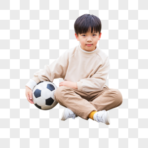 小男孩里踢足球图片