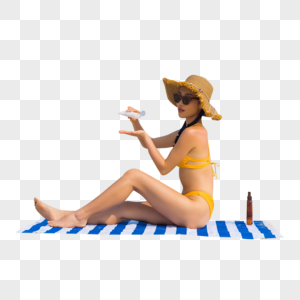 戴草帽比基尼美女沙滩上涂抹防晒高清图片