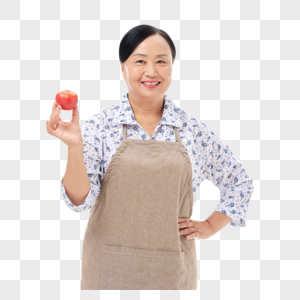 菜市场阿姨手拿番茄展示微笑高清图片素材