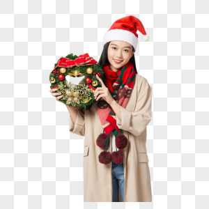 圣诞节手拿装饰物的年轻女性高清图片