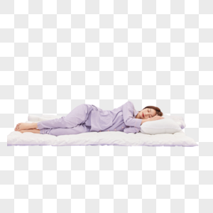 身着睡衣的年轻少女躺在被子上睡觉图片