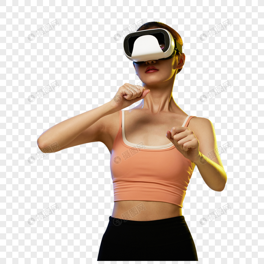 打VR拳击运动游戏的年轻女青年图片