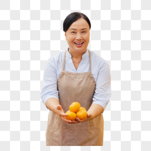 水果店店员手拿橘子展示图片