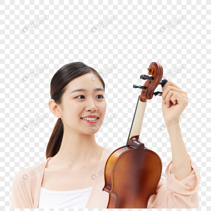 给小提琴调音的青年女性图片