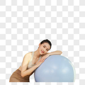 年轻运动女生与瑜伽球图片