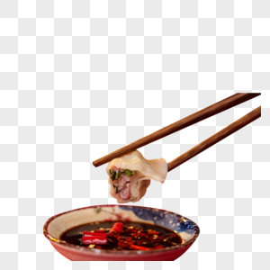 拿筷子夹饺子蘸酱油醋特写高清图片