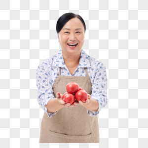 菜市场阿姨手捧番茄开怀大笑图片