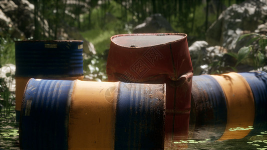绿色森林中生锈的桶说明了石油泄漏环境的污染绿色森林里生锈的桶图片