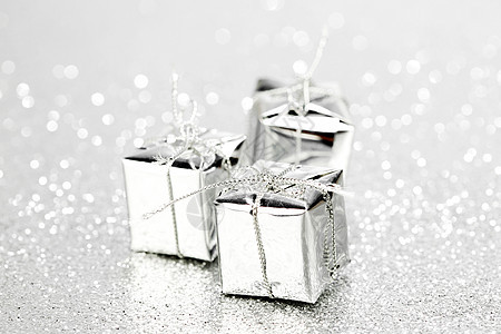 装饰银盒与节日礼物闪亮的闪光背景图片