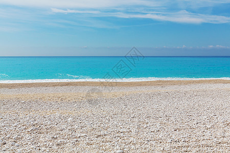 日落时美丽的海浪鹅卵石惊人的假期旅行背景图片