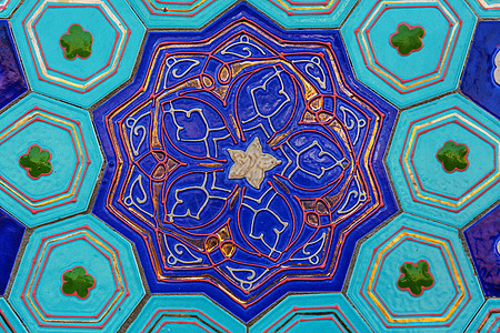 正宗美丽的传统乌兹别克花卉装饰雕刻清真寺的木门上艺术东方装饰图片