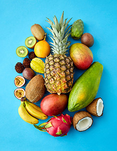 食物,夏天健康的饮食许多同的异国情调的蓝色背景蓝色背景上有许多同的异国水果图片