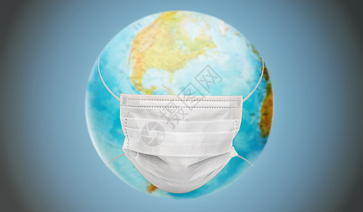 医疗保健,病大流行地球行星地球仪蓝色背景下的保护医疗面具地球行星地球仪保护医疗面具图片