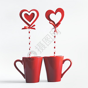 两个红色杯子,心形棒棒糖站白色的背景上宣布爱情人节的图片