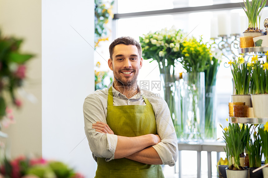 销售,小生意花卉快乐微笑的花店男子卖家花店花店柜台的花店老板卖家图片