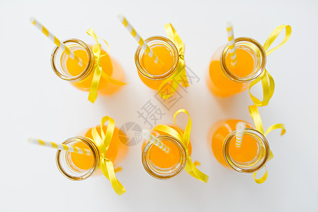 饮料派橙汁柠檬水装饰璃瓶与纸吸管顶部璃瓶中的橙汁纸吸管图片