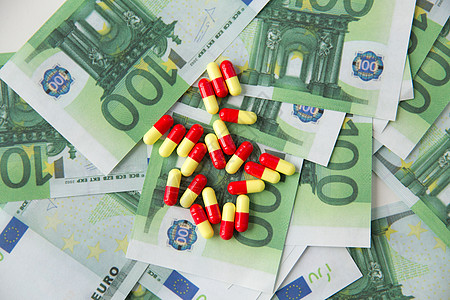 胶囊和钱医药医疗保健品贩运医疗药丸药物欧元现金药丸药物欧元现金背景