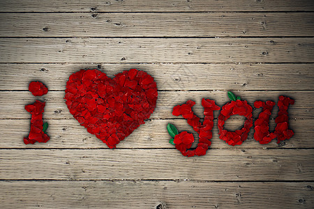 爱你的留言,红色玫瑰花瓣木制桌子上图片