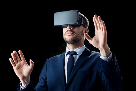 商业,人,增强现实现代技术商人虚拟耳机黑色背景商人虚拟现实耳机黑色图片