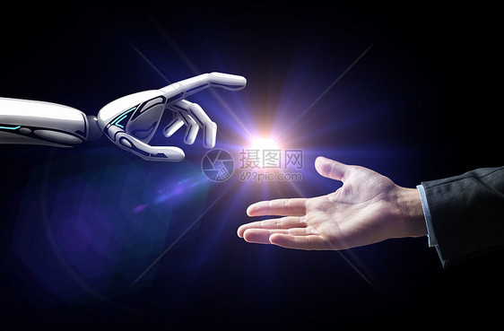 人工智能,未来技术商业机器人人的手与闪光灯黑色背景机器人人类的手闪过黑色的光图片