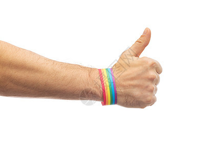 ,同关系密切的男手戴骄傲意识腕带大拇指手与骄傲彩虹腕带拇指手与骄傲彩虹图片