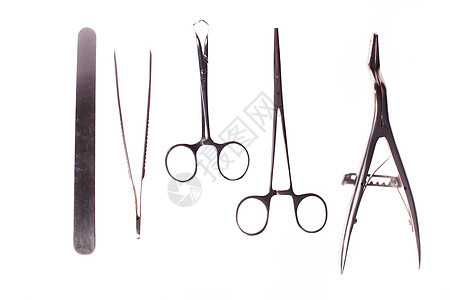 复古收集外科工具集钳子,夹子,手术用剪刀白色背景上隔离手术器械分离白色上图片