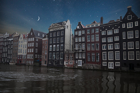 荷兰阿姆斯特丹的传统旧建筑夜晚闪耀的月亮星星阿姆斯特丹的传统旧建筑图片