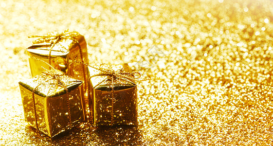 黄金装饰盒与节日礼物抽象黄金背景图片