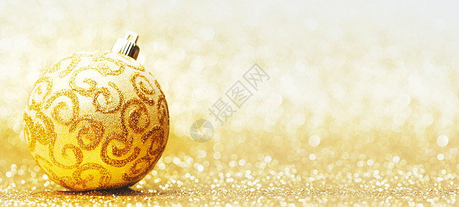 金色背景上的装饰诞球图片
