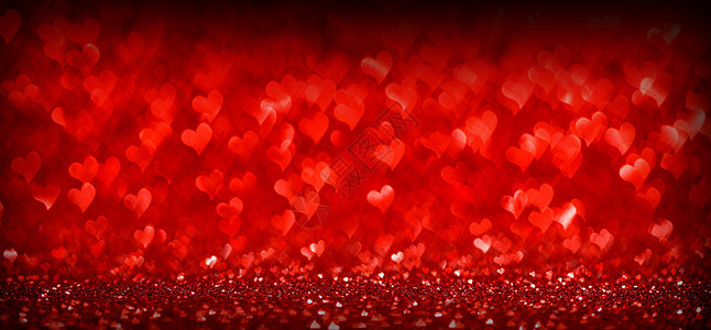 红色发光的Bokeh心脏背景情人节红色的心脏背景图片