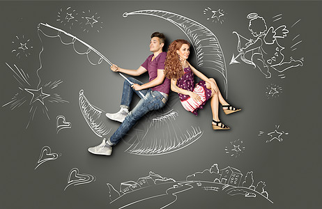 快乐的情人节爱情故事的,浪漫的夫妇钓鱼月亮上,星星钩子上,粉笔画背景的夜空丘比特图片