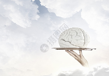 金属托盘上的大脑手金属托盘与人脑符号图片