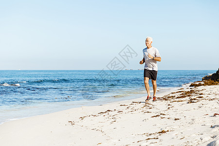 健康的跑步者海滩上健康的跑步者图片