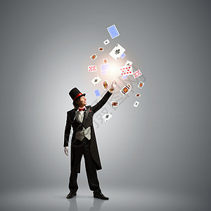 牌的魔术师戴着副扑克牌的帽子的魔术师的形象背景图片