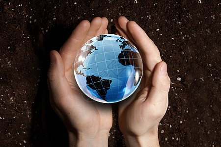人类手握数字地球行星代表全球技术图片