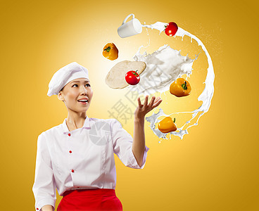 变戏法的女厨师杂耍女亚洲厨师的颜色背景背景图片