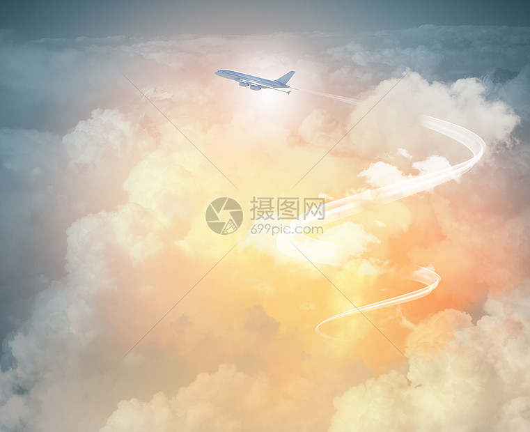 飞机天空中的形象空中飞行飞机的图像,背景为云图片