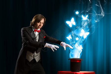 魔法小仙女戴帽子的魔术师魔术师用魔法帽子表演魔术的形象背景