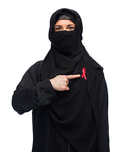 艾滋病,医疗保健人的穆斯林妇女戴头巾红色意识丝带穆斯林妇女戴着红色的头巾图片