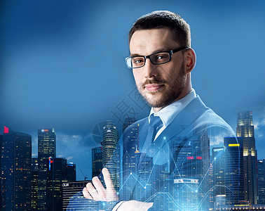 商业,人企业商人戴眼镜过夜新加坡城市摩天大楼背景虚拟图表商人戴眼镜过夜新加坡市图片