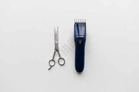头发工具,发型美发修剪机剪刀剪刀白色背景白色背景上的理发器剪刀图片