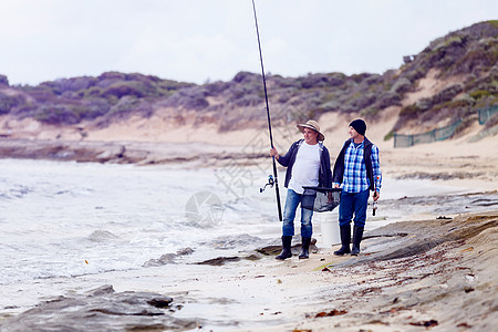 斯里兰卡钓鱼渔夫的照片渔民用鱼竿捕鱼的照片背景