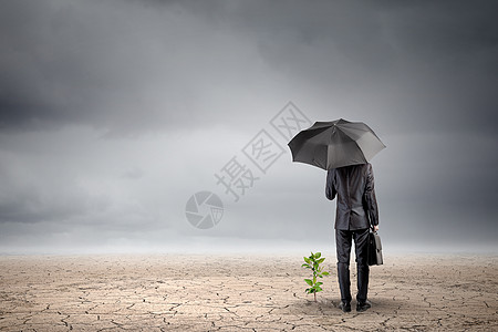 环境保护商人用雨伞保护小芽的后视镜图片