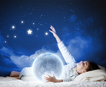 星星的孩子晚上梦可爱的男孩月亮睡床上背景