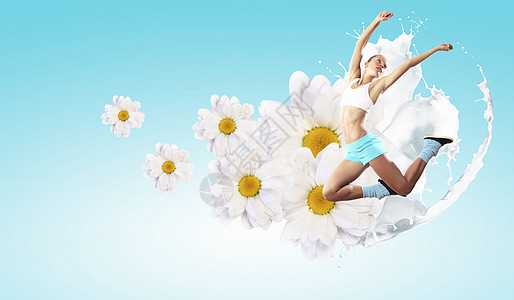 运动女跳跃的形象运动女孩花卉背景下跳跃的形象图片