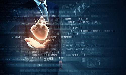 医学创新密切的商人持数字心脏掌心图片