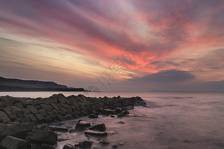 惊人的日落景观图像的岩石海岸线多塞特英国图片