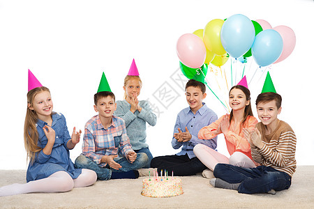 气球女孩童,假期,友谊人的快乐的微笑孩子戴着生日蛋糕气球的派帽背景